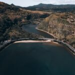 aerial view of river between mountains during daytime