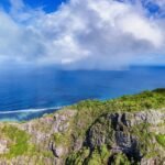 A scenic view of the ocean from the top of a mountain