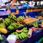 Fresh tropical fruits displayed at a market stall.