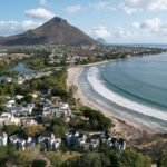 Coastal town with a mountain and a beach.