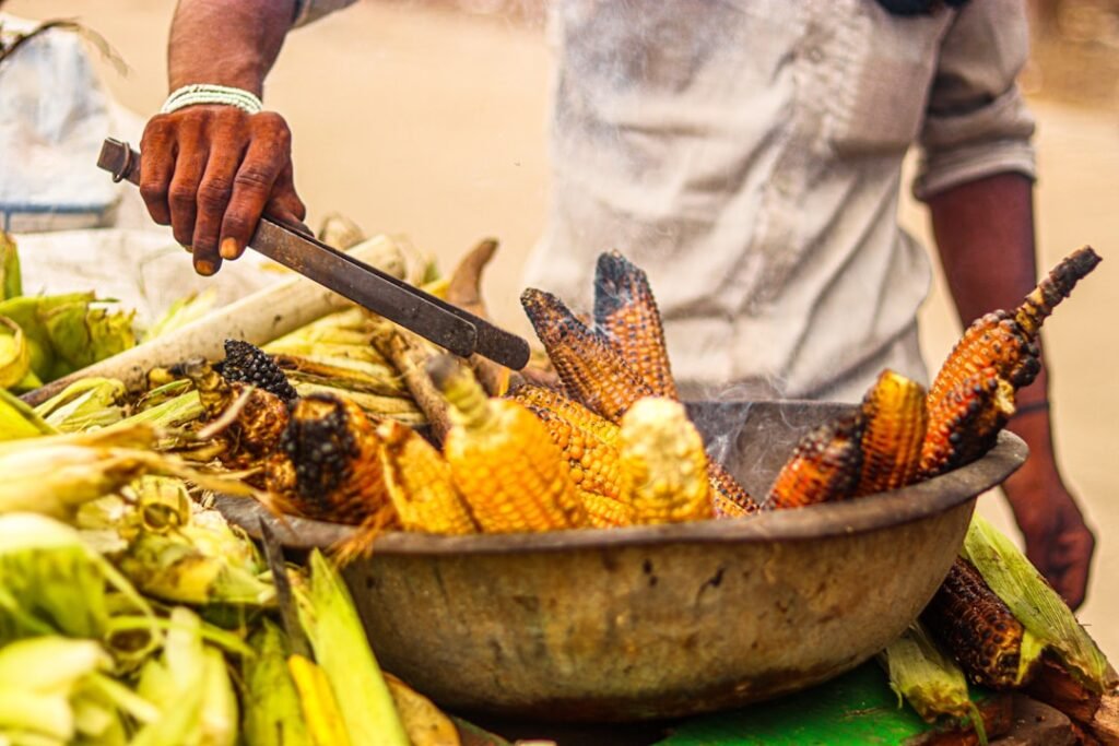 a person cutting a large pot of food