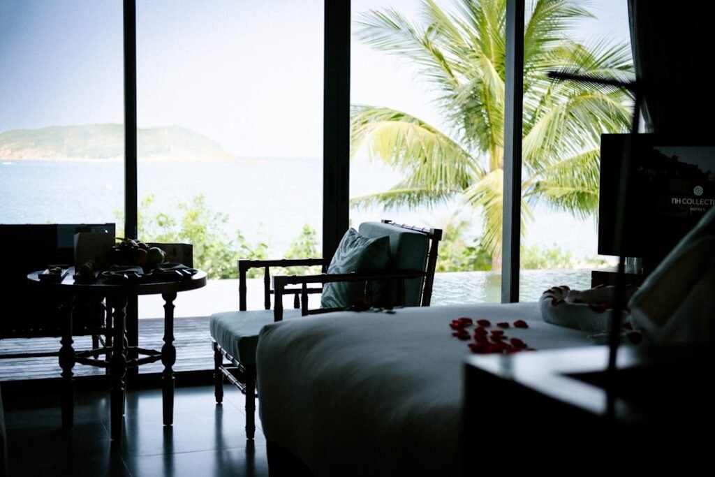 A bedroom with a view of the ocean