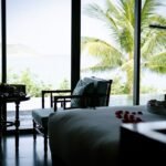A bedroom with a view of the ocean