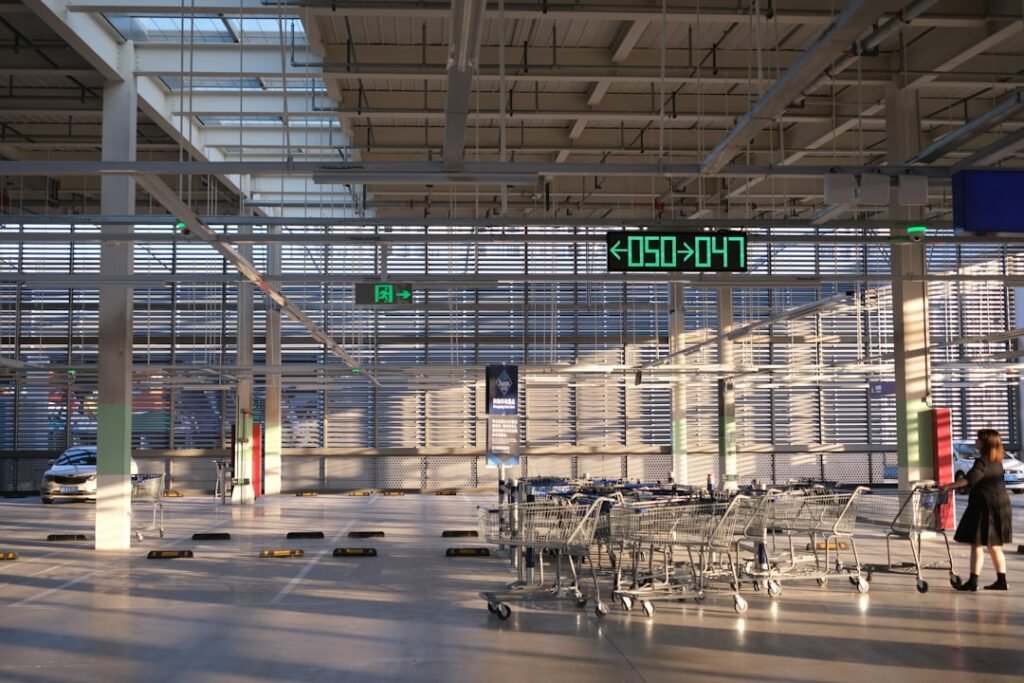 a woman is walking through an airport terminal