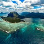 green island in the middle of body of water