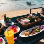 Delicious food and drinks are ready on the beach.