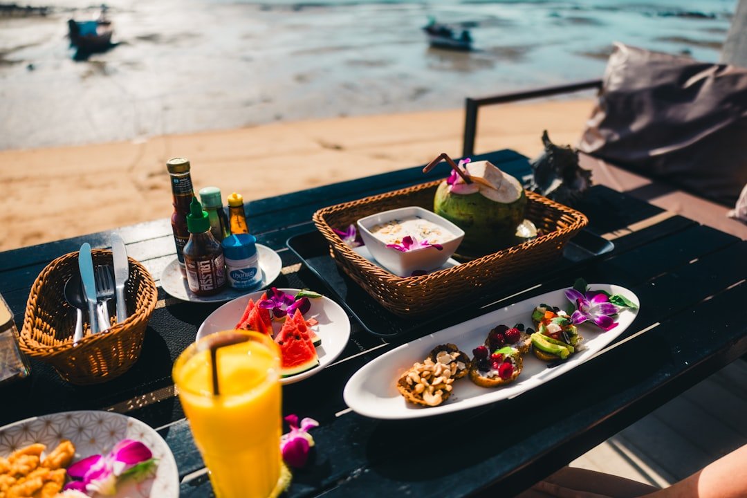 Delicious food and drinks are ready on the beach.