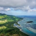 an aerial view of the ocean and land