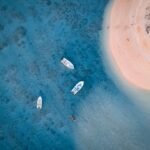 aerial photography of docked boats near island