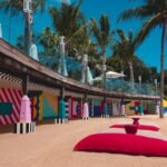 architectural photography of pink, blue, yellow, and white wall