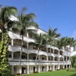 a building with palm trees