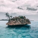 rock on body of water