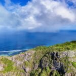 A scenic view of the ocean from the top of a mountain