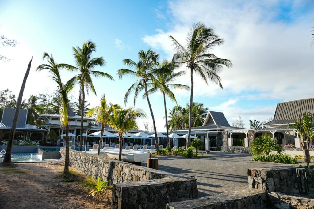 A resort with palm trees in the foreground